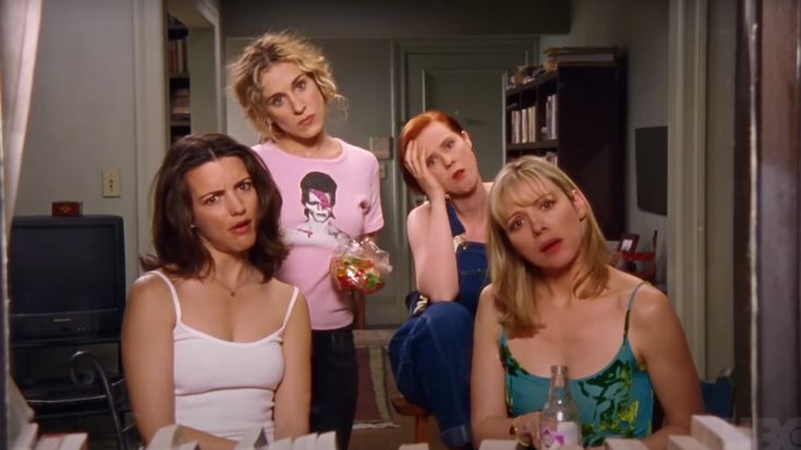 Four women looking at the camera with unimpressed expressions