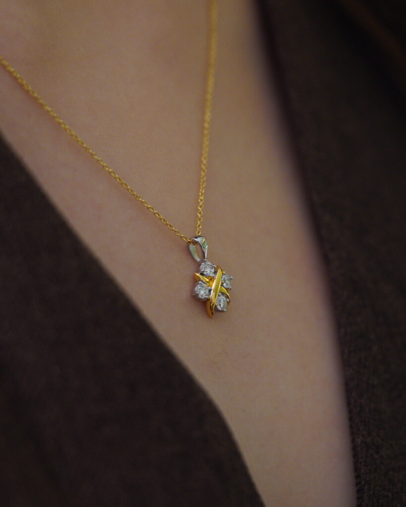 Eclisse Two-Toned Necklace with gold and platinum vermeil worn close to collarbone